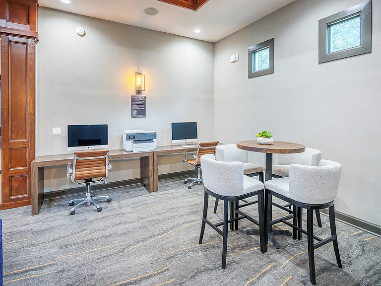 Business center with Mac and PC computers