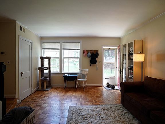 Sunny living room with beautiful hardwood floors.