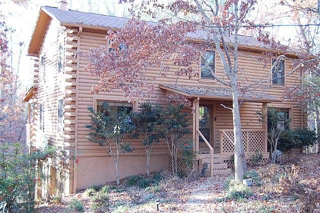 A two story log cabin on over an acre of land with a full basement.