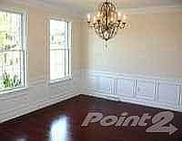 Elegant formal dining room with upgraded chandelier and African Cherry hardwood