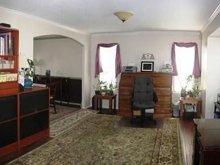 Generously Sized Living Room Features Wide Plank Wood Floors