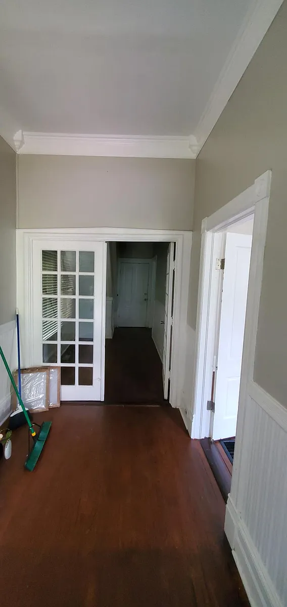 Foyer looking down small hall leading to kitchen. - 983 Magnolia St #1
