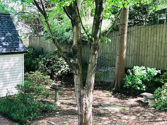 Direct access to the serene backyard; view from the deck of the 1BR apartment