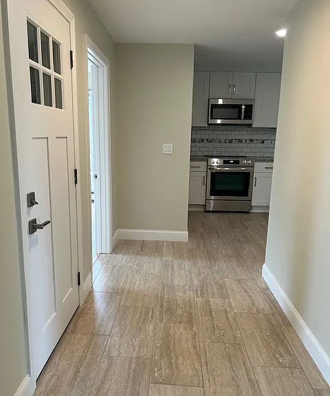 entry to kitchen and bedroom on right