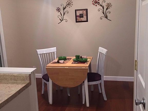 Dining area off kitchen, sliding door to deck.