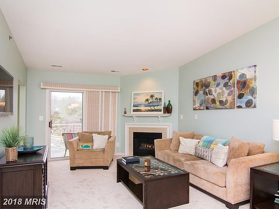 Spacious living room with gas fireplace.