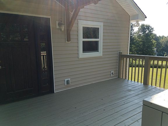 Overview of deck and entryway. Roof over entry for those r