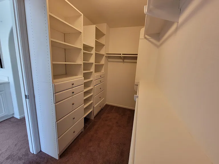 Walking Master closet has plenty of drawers and closet space