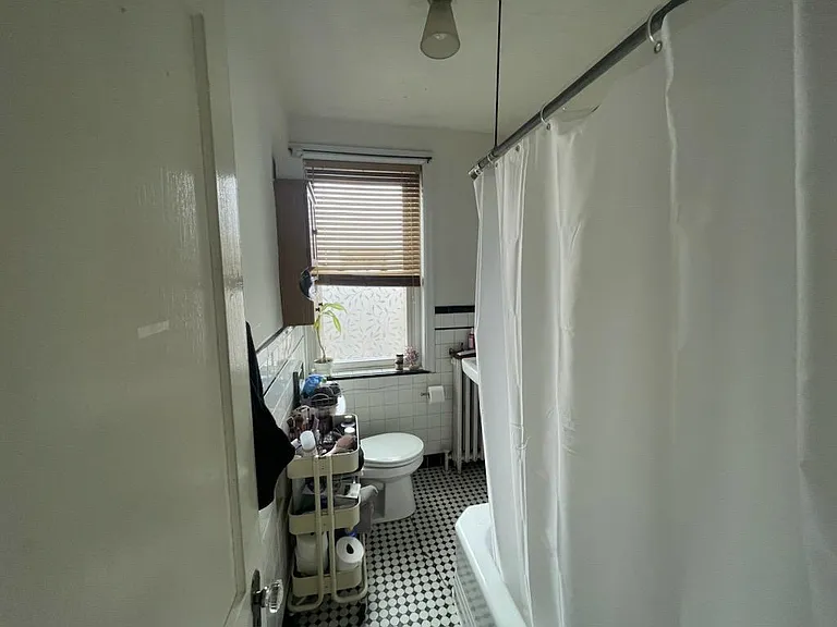 Photo from 2024, classic bathroom with a nice tub!