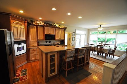 Kitchen has solid surface countertops, gas cooktop, convection oven, all appliances included
