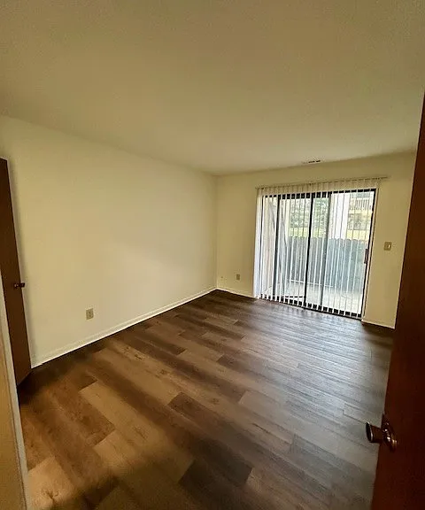 Second bedroom with sliding glass doors to patio