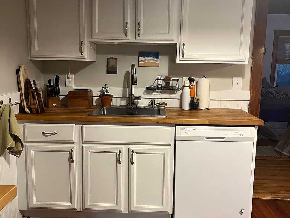 Plenty of cabinet storage and convenient kitchen layout with fab counter space and sink next to dishwasher.