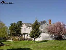 Side view shows shed and deck