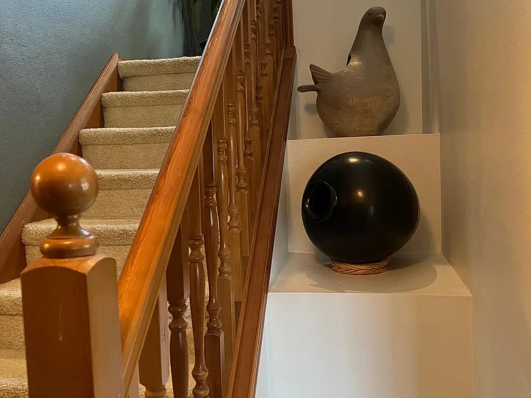 Stairs leading to bonus room/office or 5th bedroom.