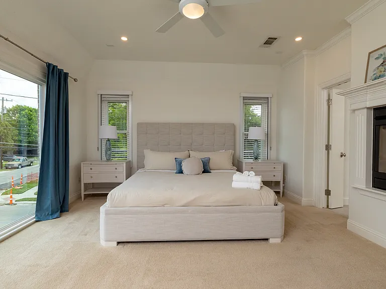 Bright king bedroom with expansive views and high-end finishes.