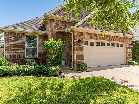 A lush lawn with mature trees and landscaping offers such great curb appeal!