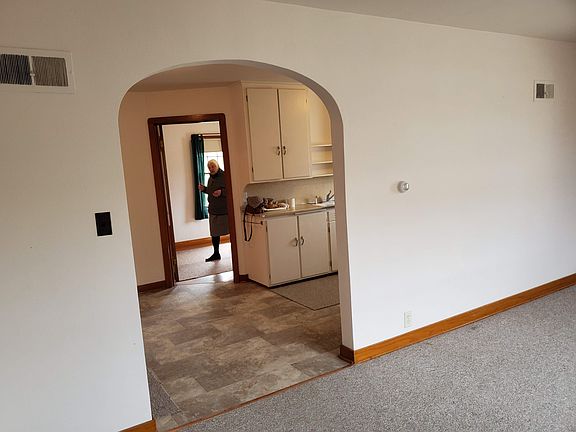 view of living room looking towards kitchen and bedroom