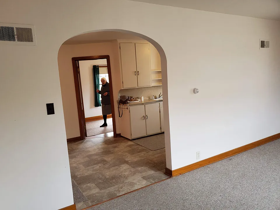 view of living room looking towards kitchen and bedroom