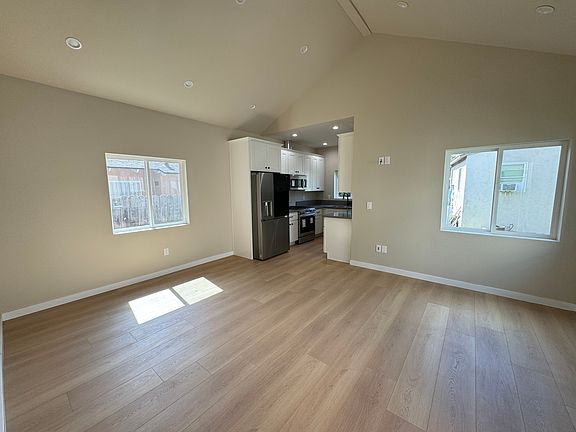 large living room with vaulted ceiling