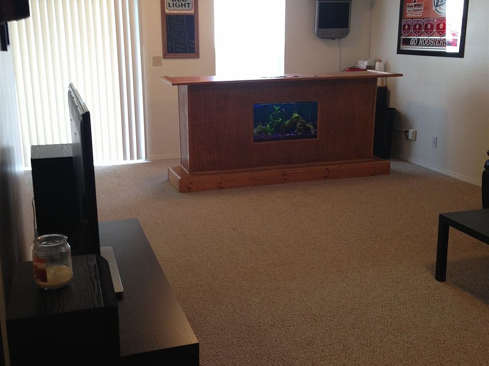 Large open Living/Dining area with sliding glass door to dec