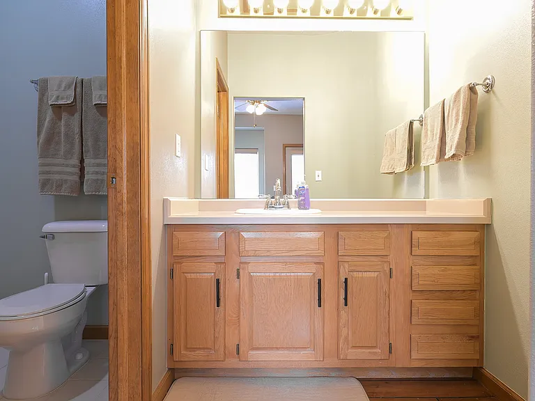Third floor bedroom with private vanity and bathroom