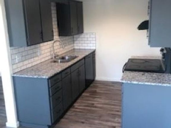 Newly remodeled kitchen with granite countertop. Black refrigerator arriving soon!