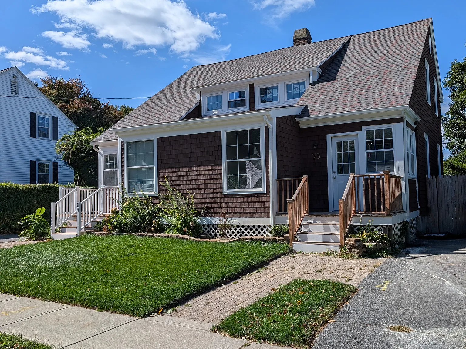 #73 right side property with driveway, pictured.