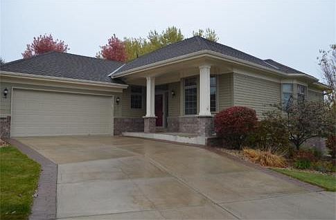 Executive rambler style detached townhome in Evermoor that backs up to a nature area for spectacular