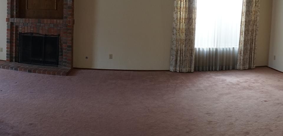 Open living room and dining room area.