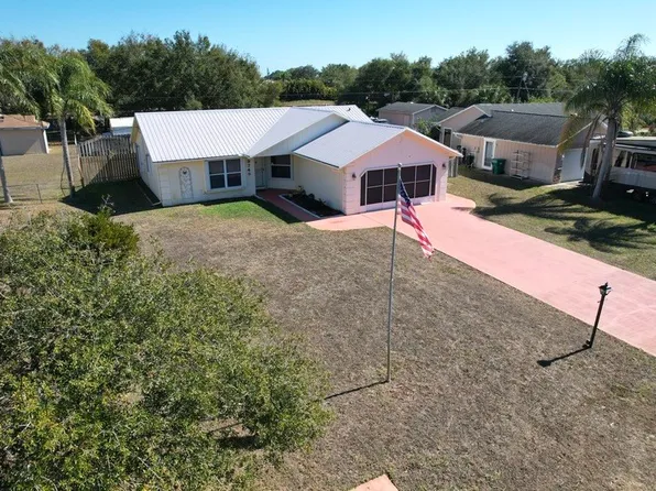 9745 Honeysuckle Dr, Micco, FL 32976