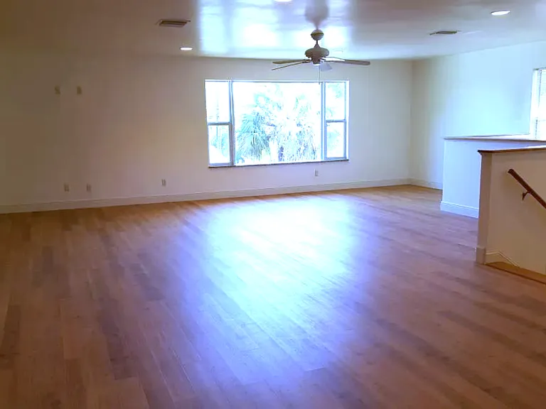 Living room and picture window. Window is 9' wide