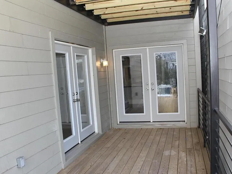 Expansive deck for entertaining and access to the rear driveway