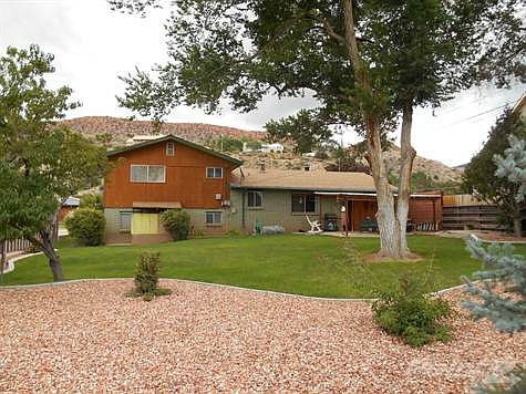 Fully landscaped with mature trees and manicured lawns