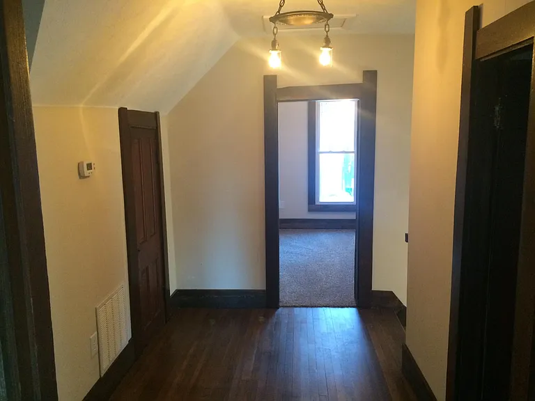 upstairs landing, upstairs has its own HVAC system and thermostat to make sure everyone is comfortable. small door on the left gives you access to furnace room.