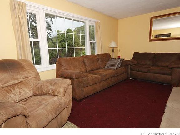 Living room with large wind...