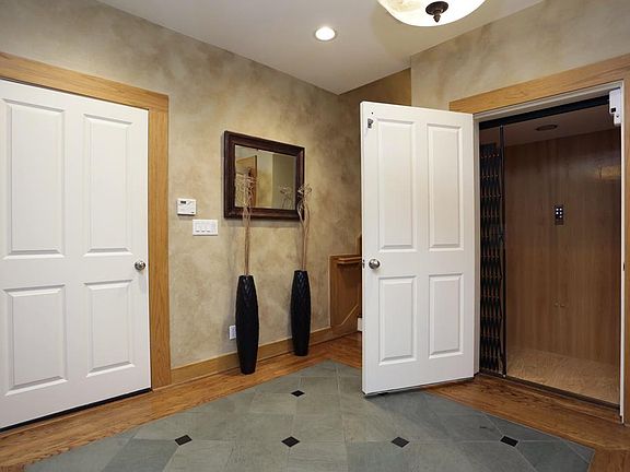 Foyer/ Elevator:
If you have just got done grocery shopping or are carrying luggage in from an awesome vacation, skip the stairs and take the elevator. This feature offers convenience and better mobility regardless of the task.