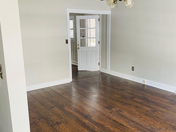 Living room -- connects to eat -in kitchen and family room with brick fireplace