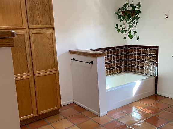 Huge main bathroom with both shower and bath tub.