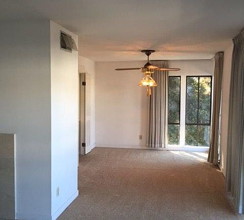 Dining and living room with views of Oakland and balcony