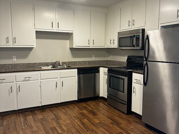 Full kitchen with dishwasher, microwave, full-size fridge