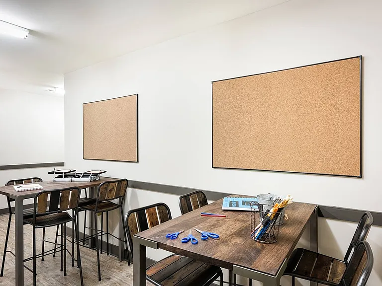 Dedicated craft and DIY room with open work space and lockable storage