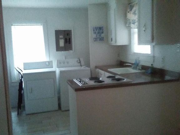 Kitchen with washer and dryer