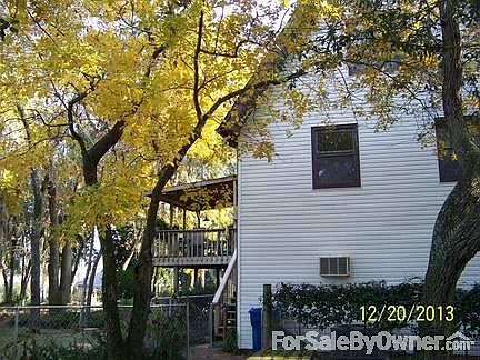 North side of House
						:
						This view also shows the deck & some of the hickory trees in full autumn color.