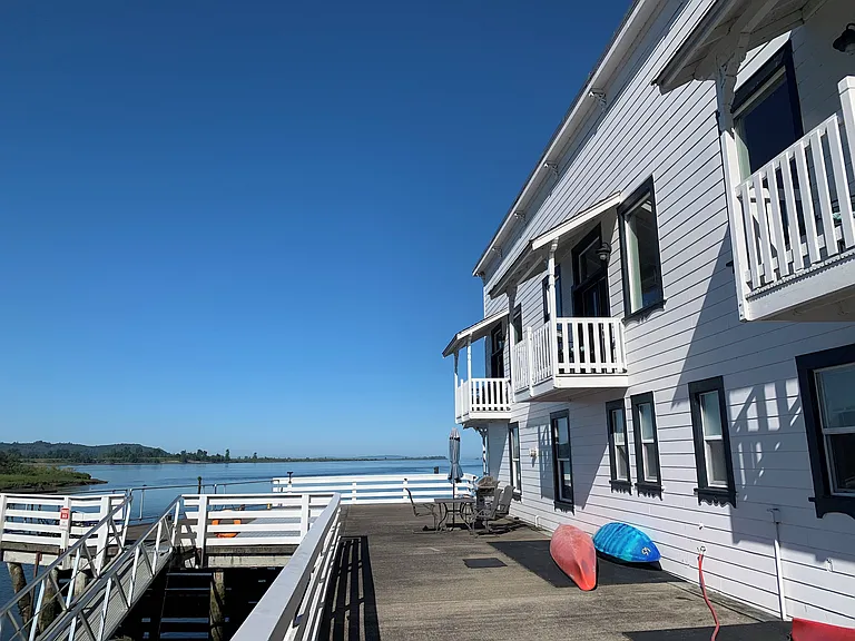 Common deck over Steamboat Slough w/ dock. Private balconies.
