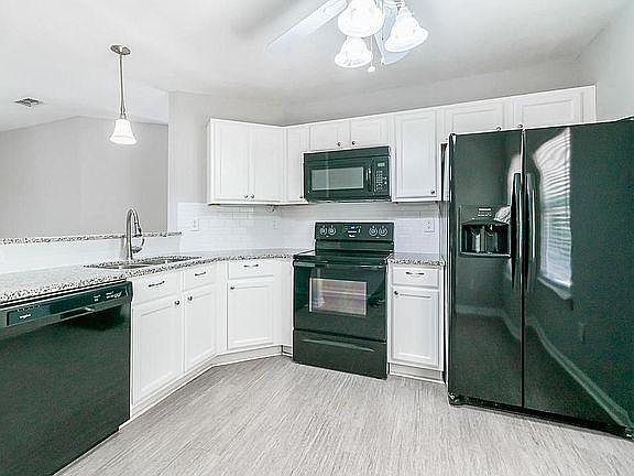Newly renovated kitchen with brand new appliances, cabinets, flooring, and sinks