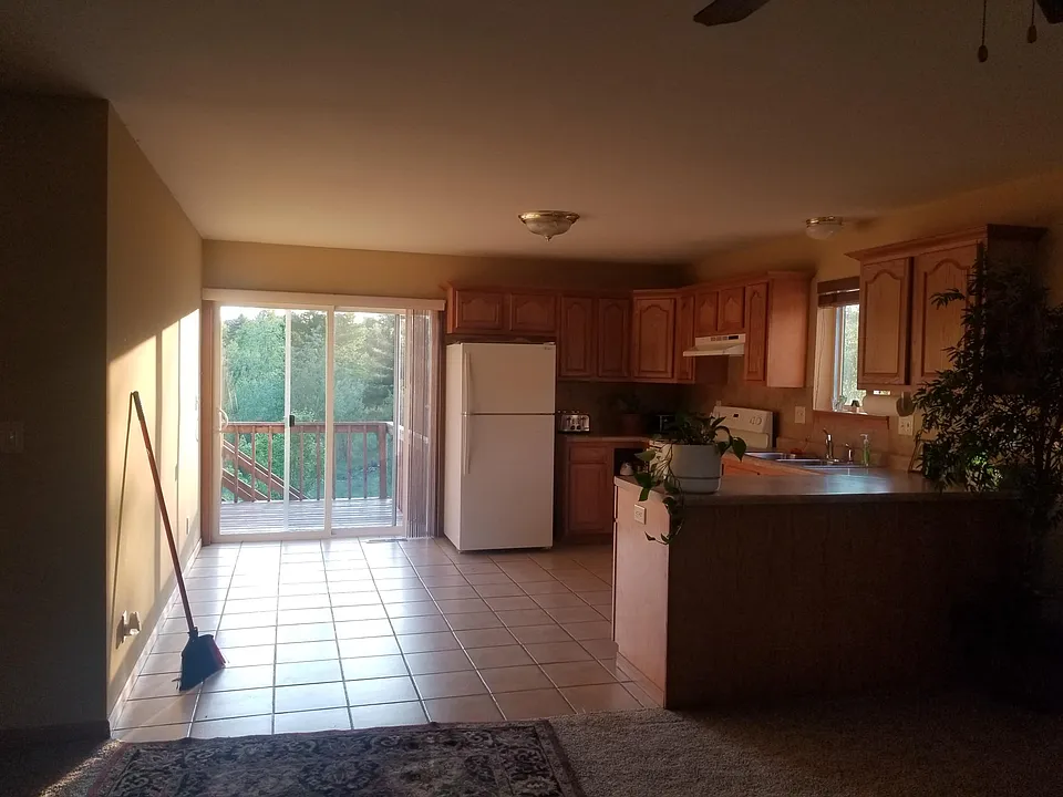 Kitchen open to LR with walk out balcony