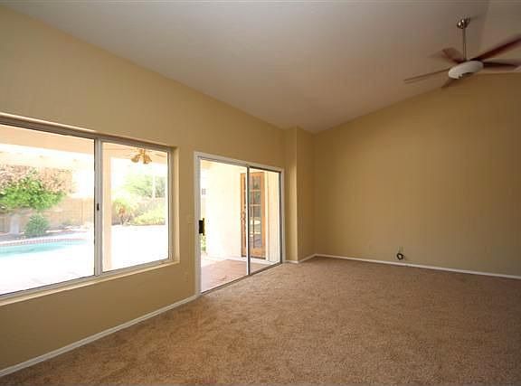 Living room with doors to backyard