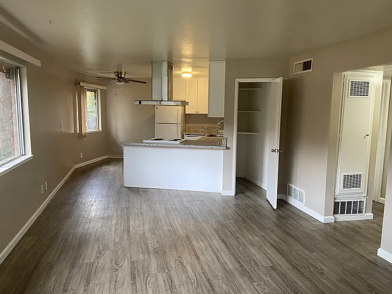 Upgraded wood plank flooring and a bright, spacious living area_perfect for entertaining or unwinding. Features an eat-in kitchen with a beautiful ceiling fan, two bedrooms, and extra linen storage to fit your lifestyle.