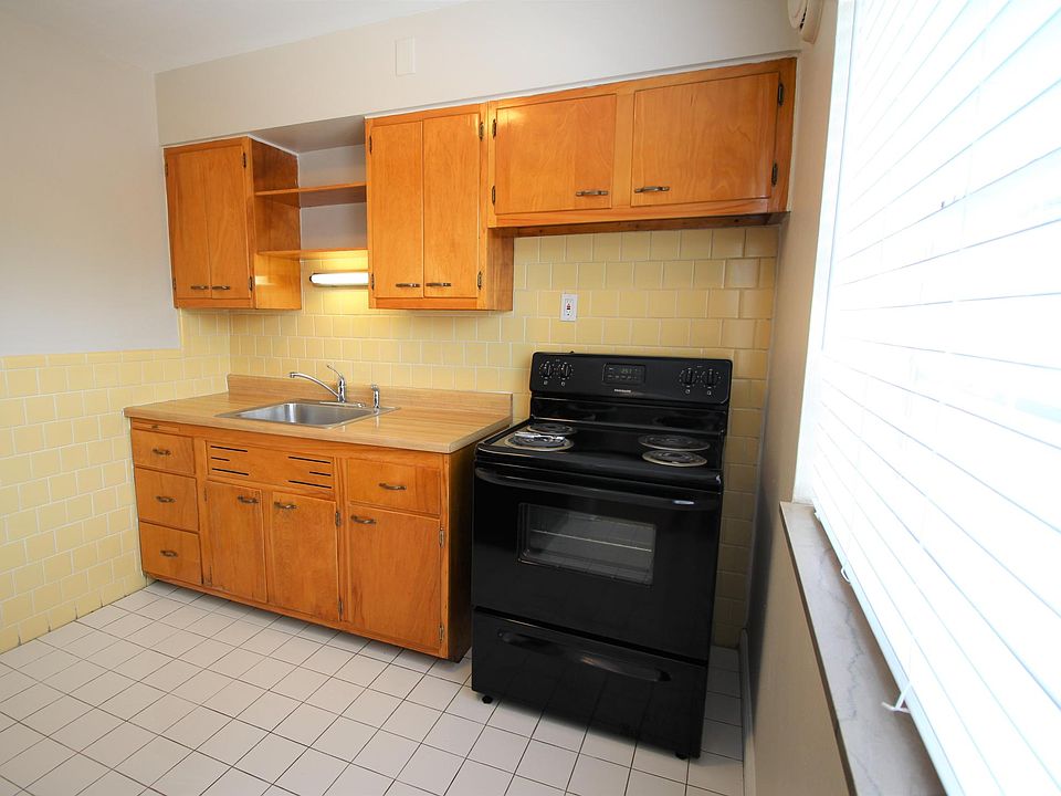 Charming kitchen with restored cabinets.