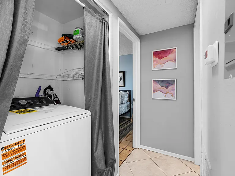 Washing machine inside and dryer in the garage.